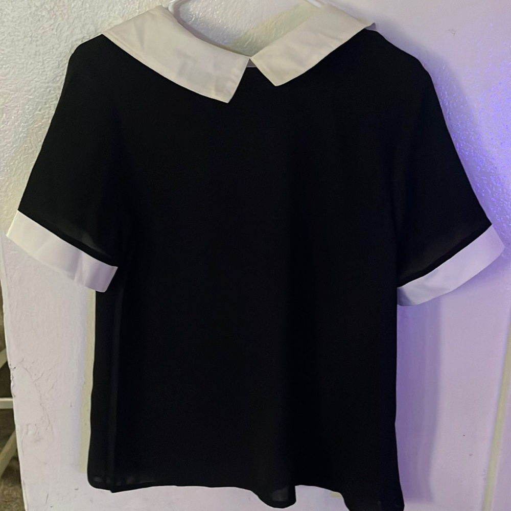 Black and white colored blouse